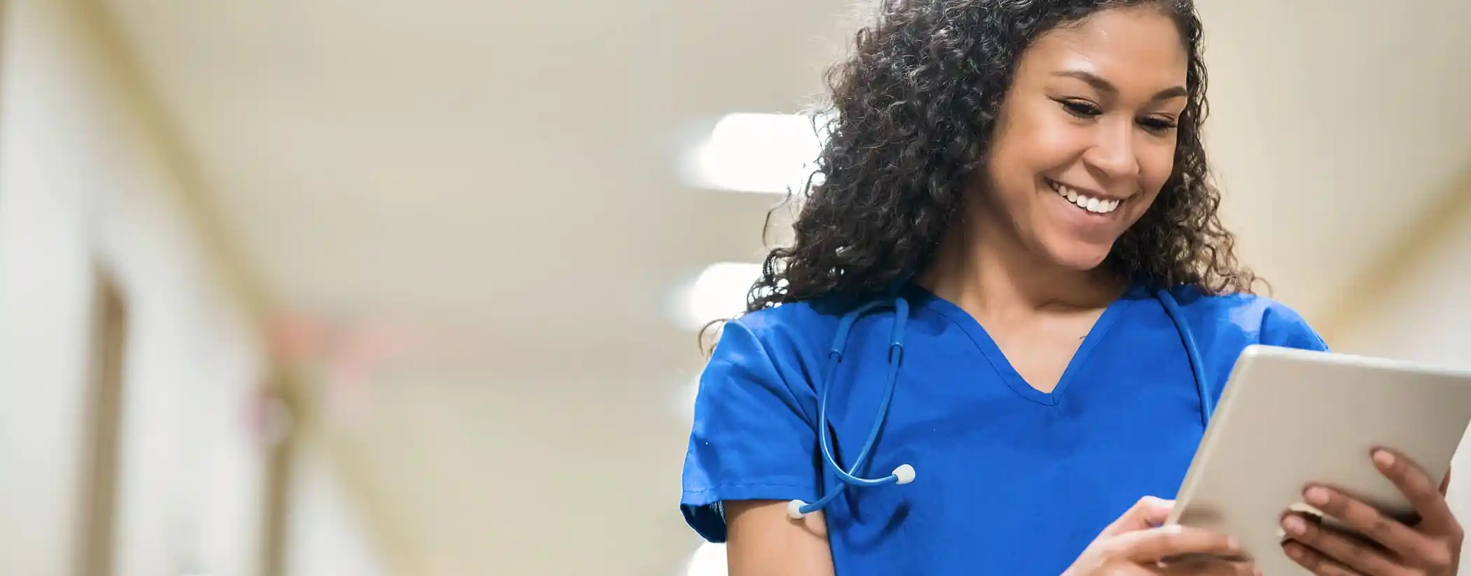 Nurse learning on tablet